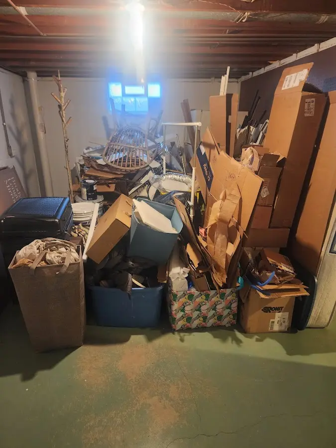 Roll-off dumpster container at job site for Yard Waste Dumpster Rental in Griswold